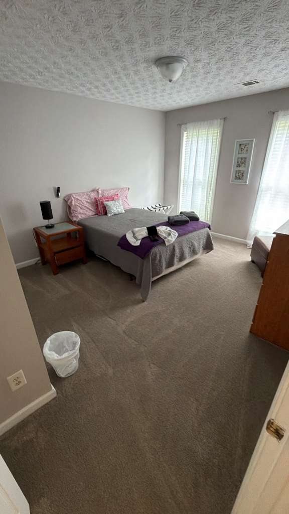 Cleaned bedroom with carpet